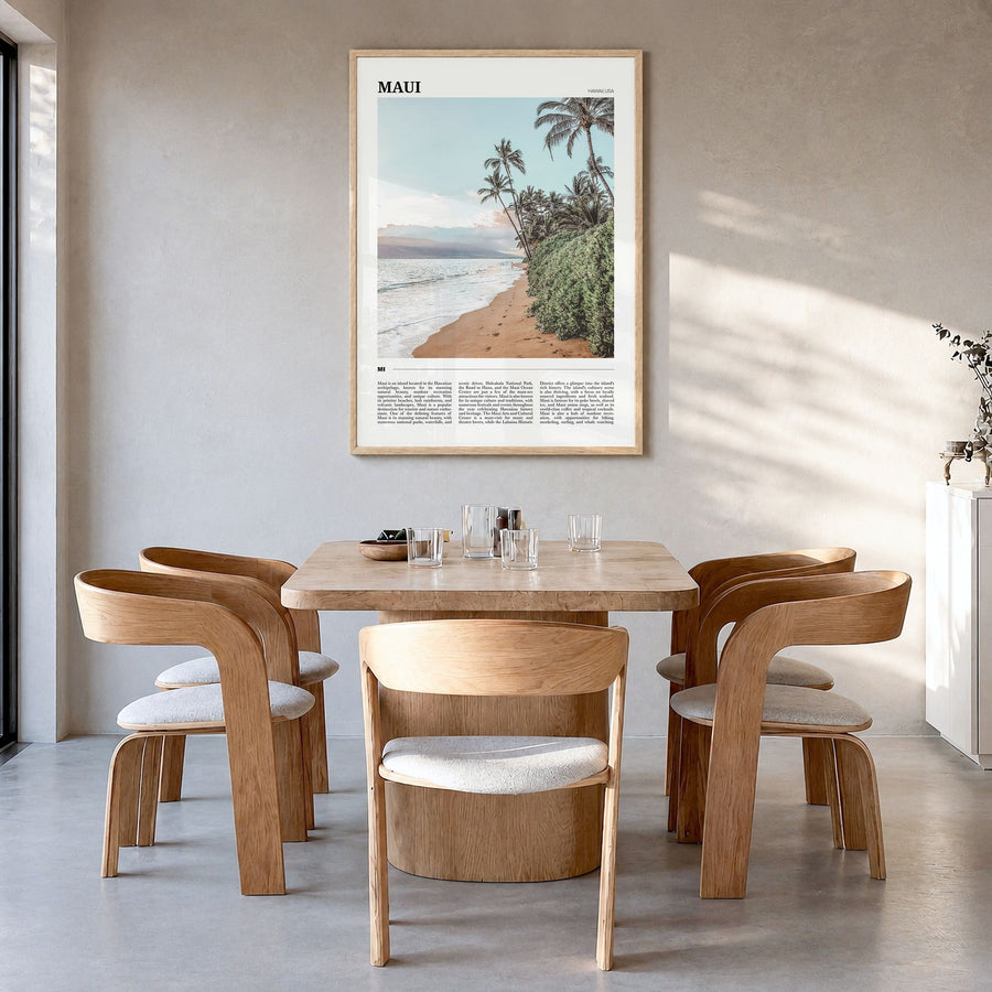 Maui Travel Poster in a natural wood frame, hanging in a dining room