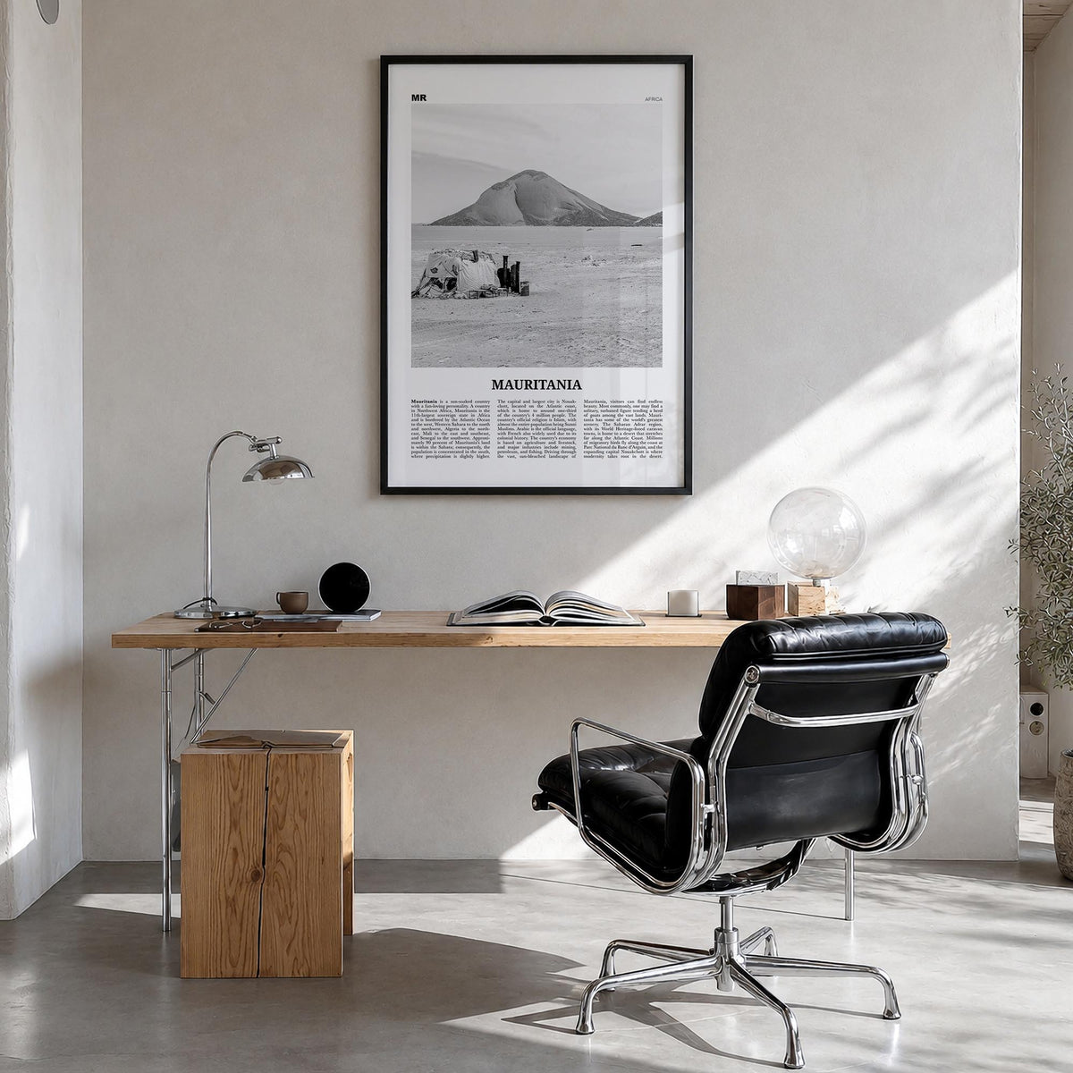 Mauritania black & white newspaper poster of Africa – vertical wall art in black wood frame, hanging on wall