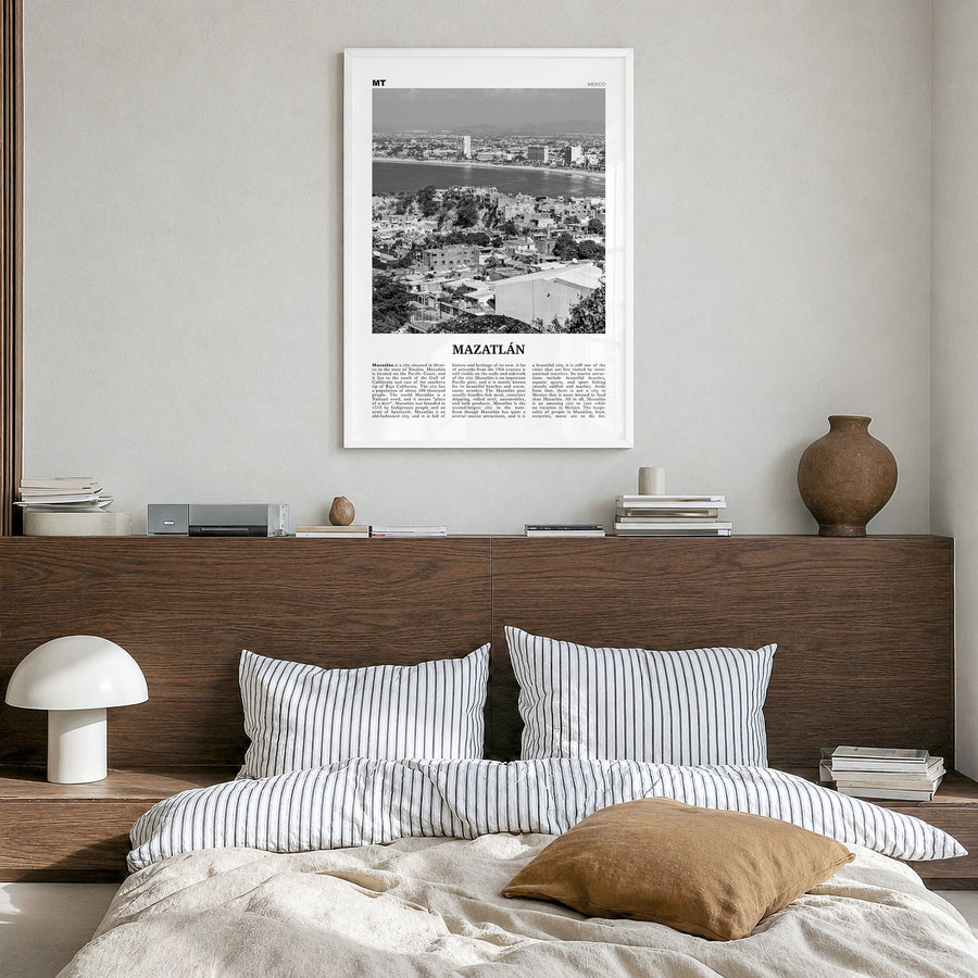 Mazatlán Newspaper Poster in a white wood frame, hanging in a bedroom