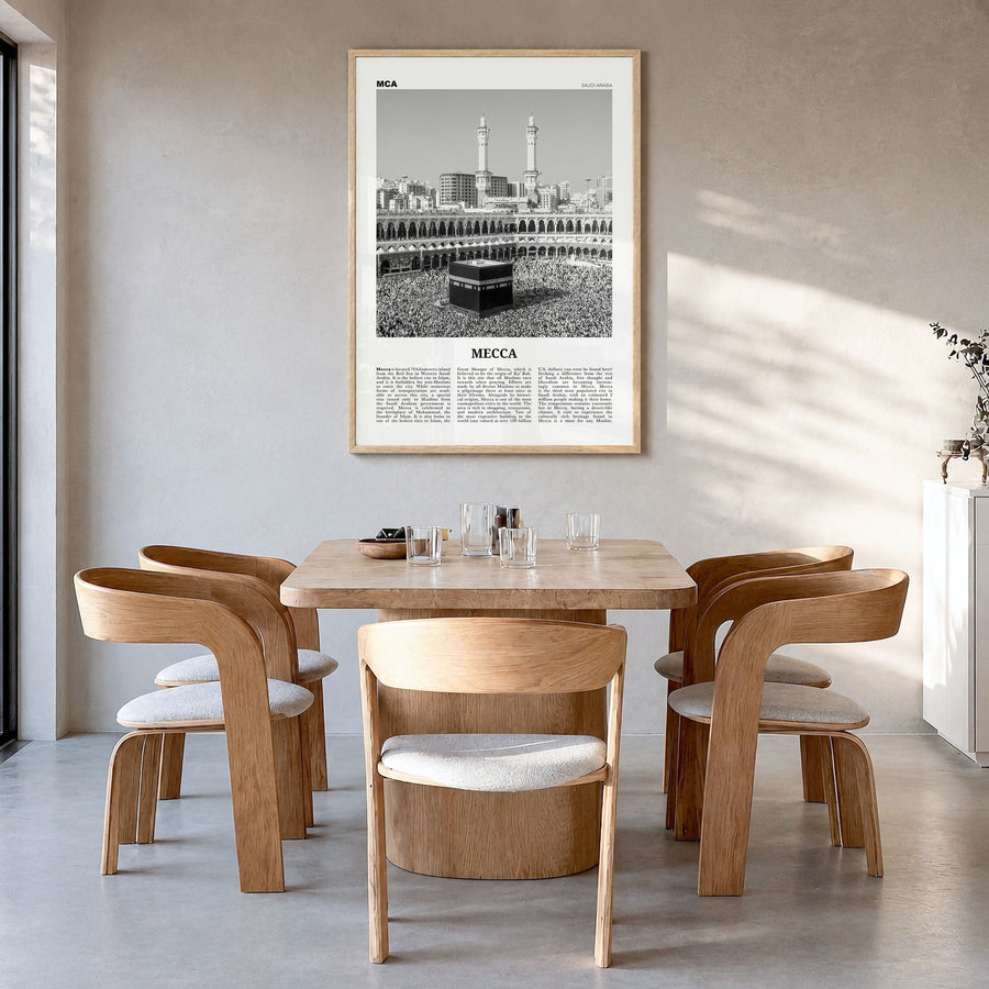 Mecca Newspaper Poster in a natural wood frame, hanging in a dining room