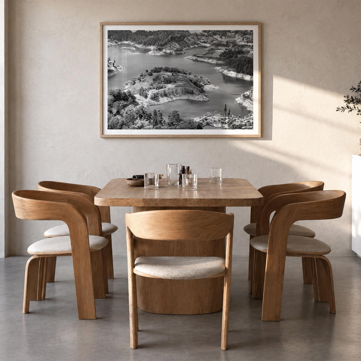 Medellín black & white photo poster of Colombia – horizontal wall art in natural wood frame with white border, hanging on wal
