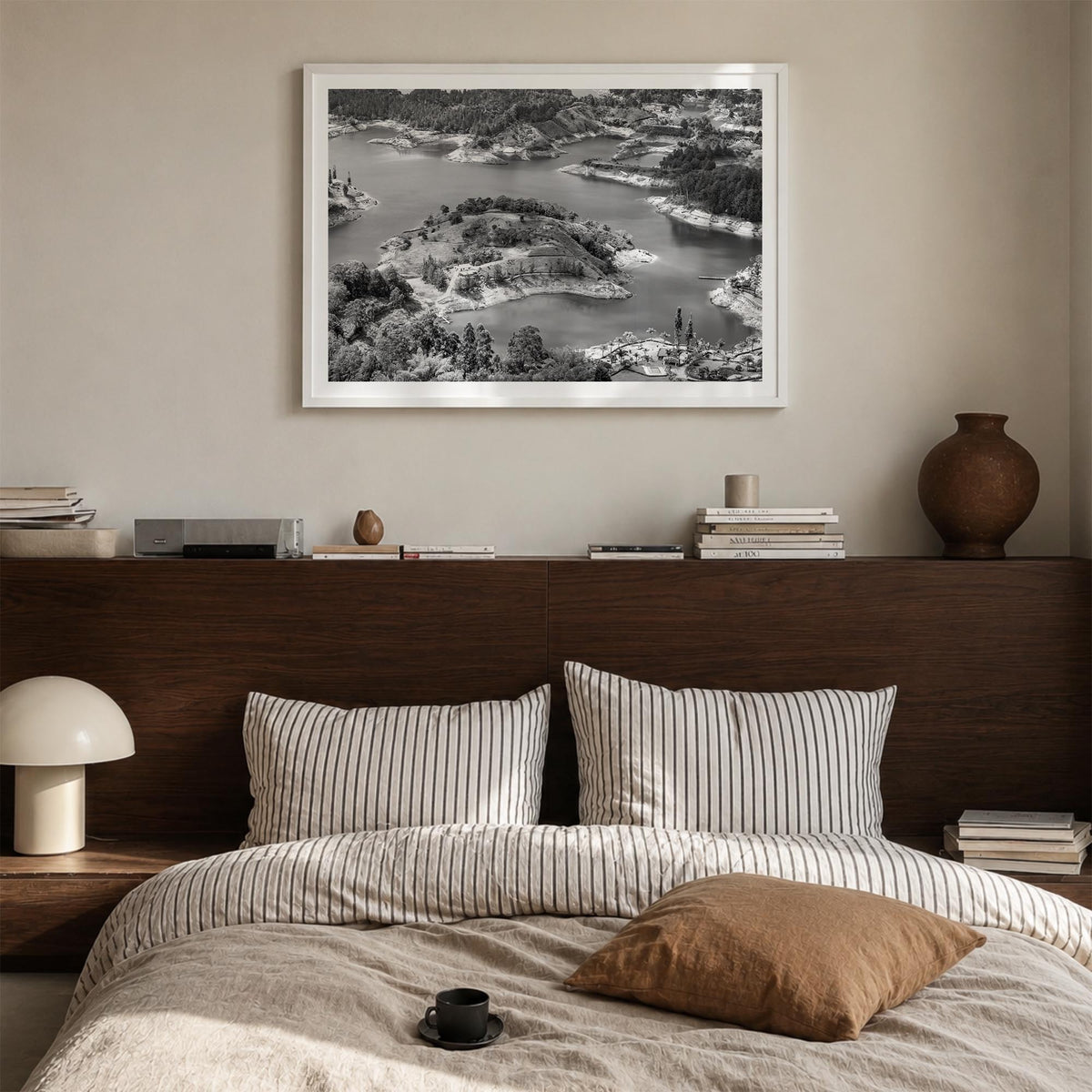 Medellín black & white photo poster of Colombia – horizontal wall art in white wood frame with white border, hanging on wall