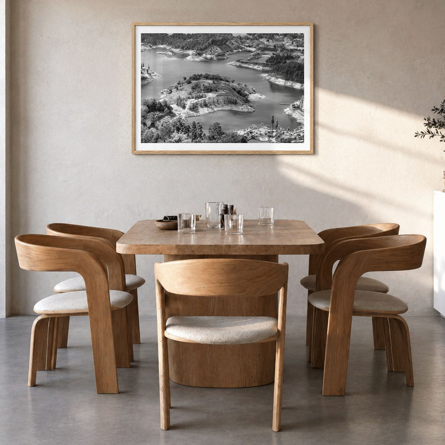 Medellín Photo Poster in a natural wood frame, hanging in a dining room, white border