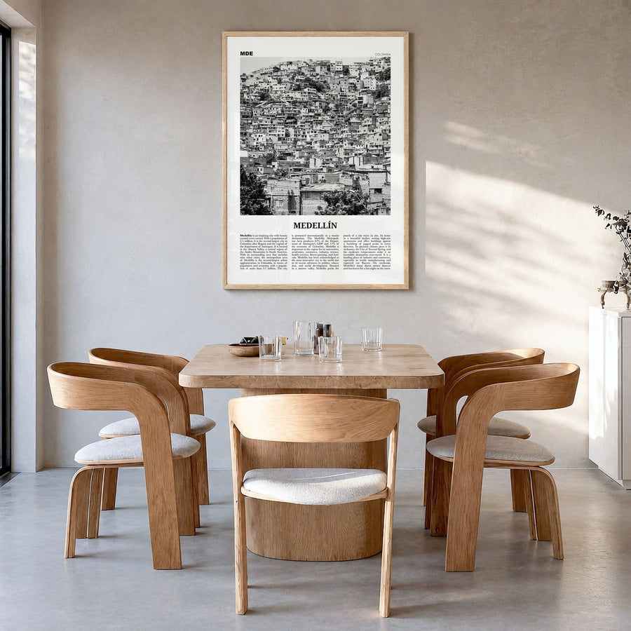 Medellín Newspaper No 2 Poster in a natural wood frame, hanging in a dining room
