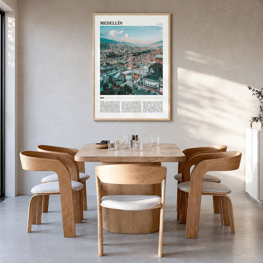 Medellín Travel Poster in a natural wood frame, hanging in a dining room