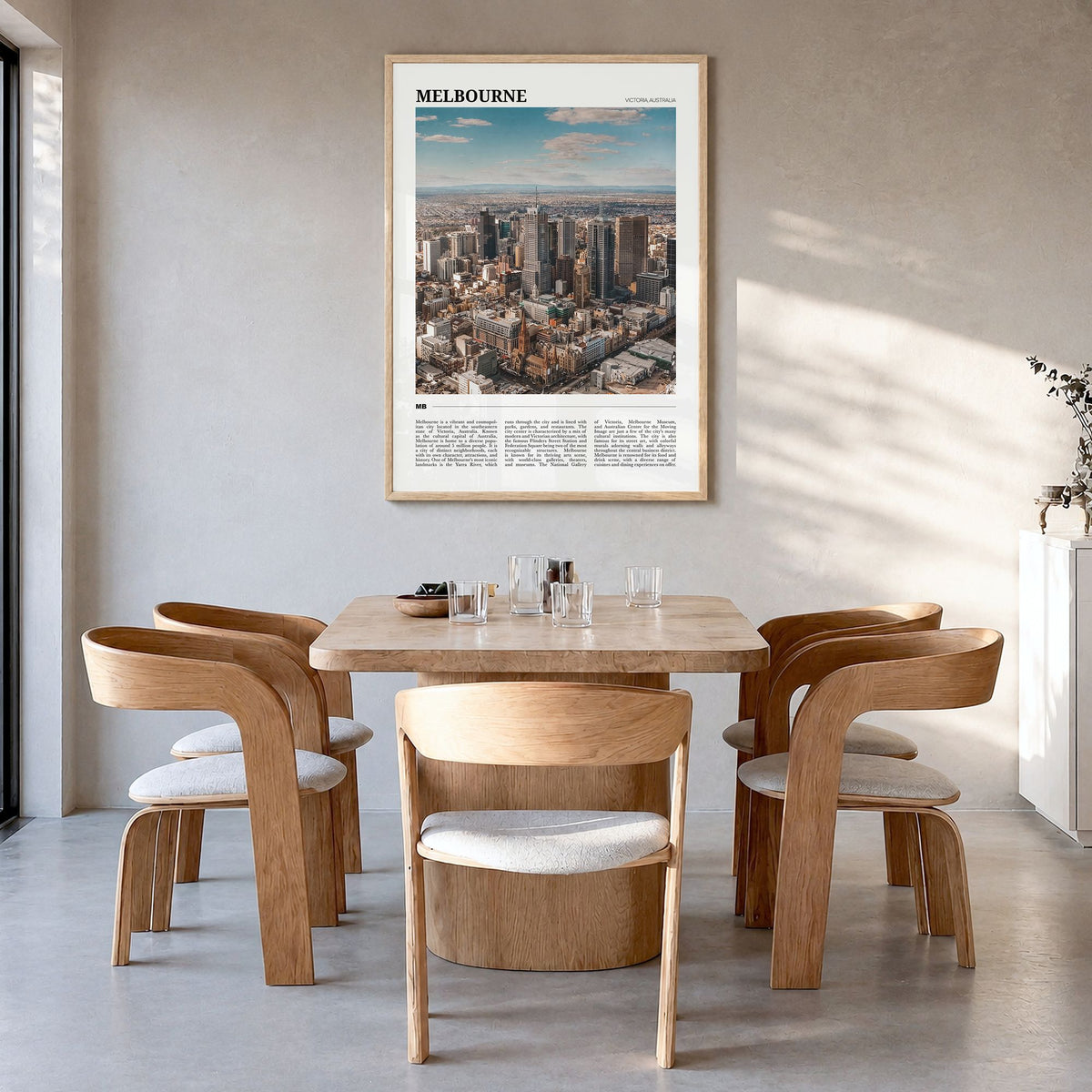 Melbourne Travel Poster in a natural wood frame, hanging in a dining room