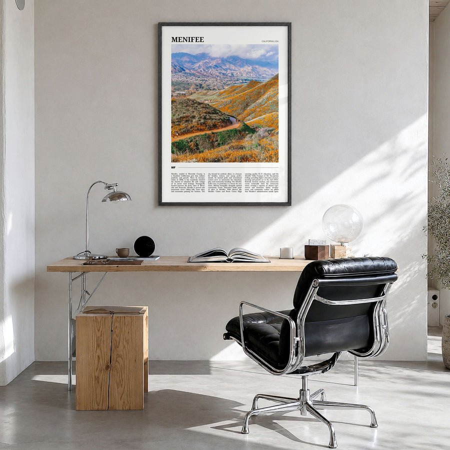 Menifee Travel Poster in a black wood frame, hanging in a bright home office