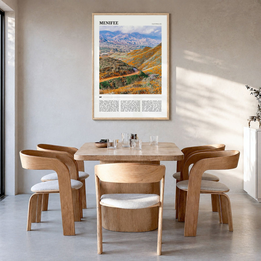 Menifee Travel Poster in a natural wood frame, hanging in a dining room