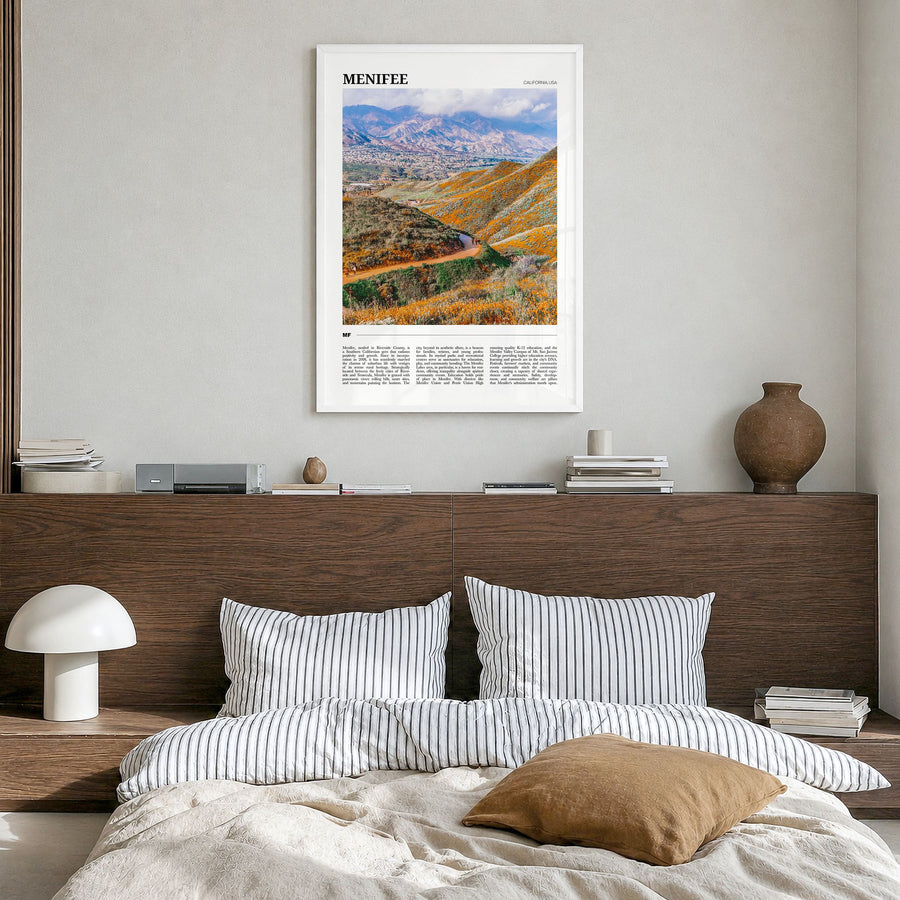 Menifee Travel Poster in a white wood frame, hanging in a bedroom