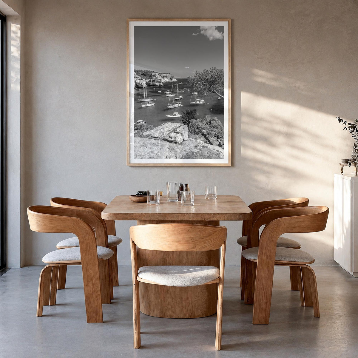 Menorca black & white photo poster of Spain – vertical wall art in natural wood frame with white border, hanging on wall