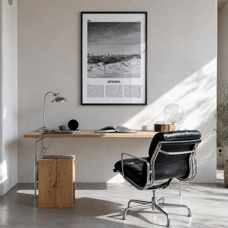 Méribel black & white newspaper poster of France – vertical wall art in black wood frame, hanging on wall