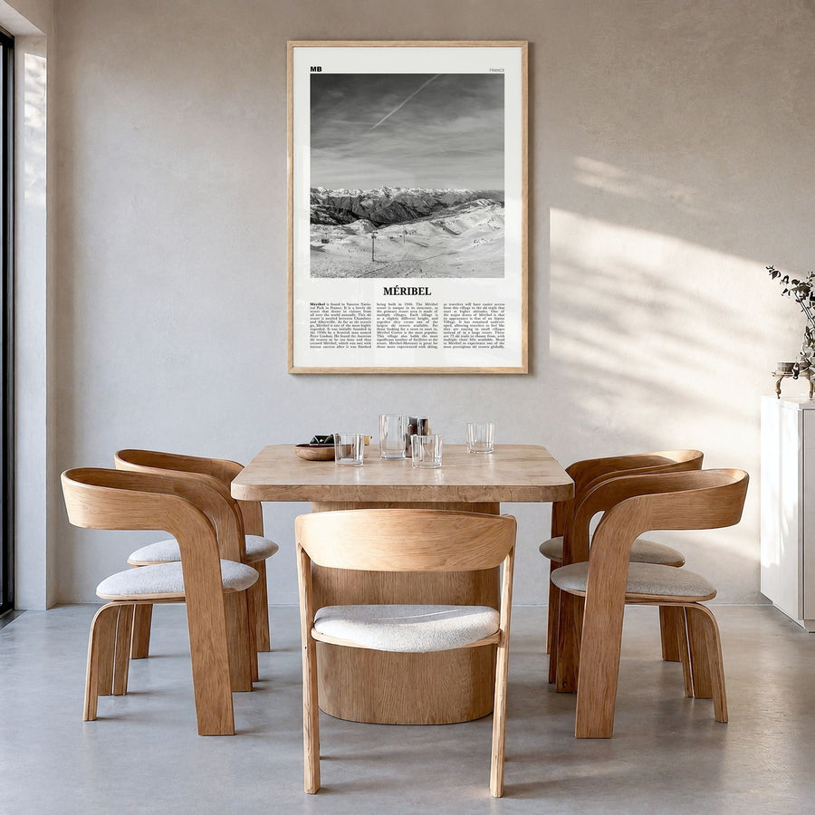 Méribel Newspaper Poster in a natural wood frame, hanging in a dining room