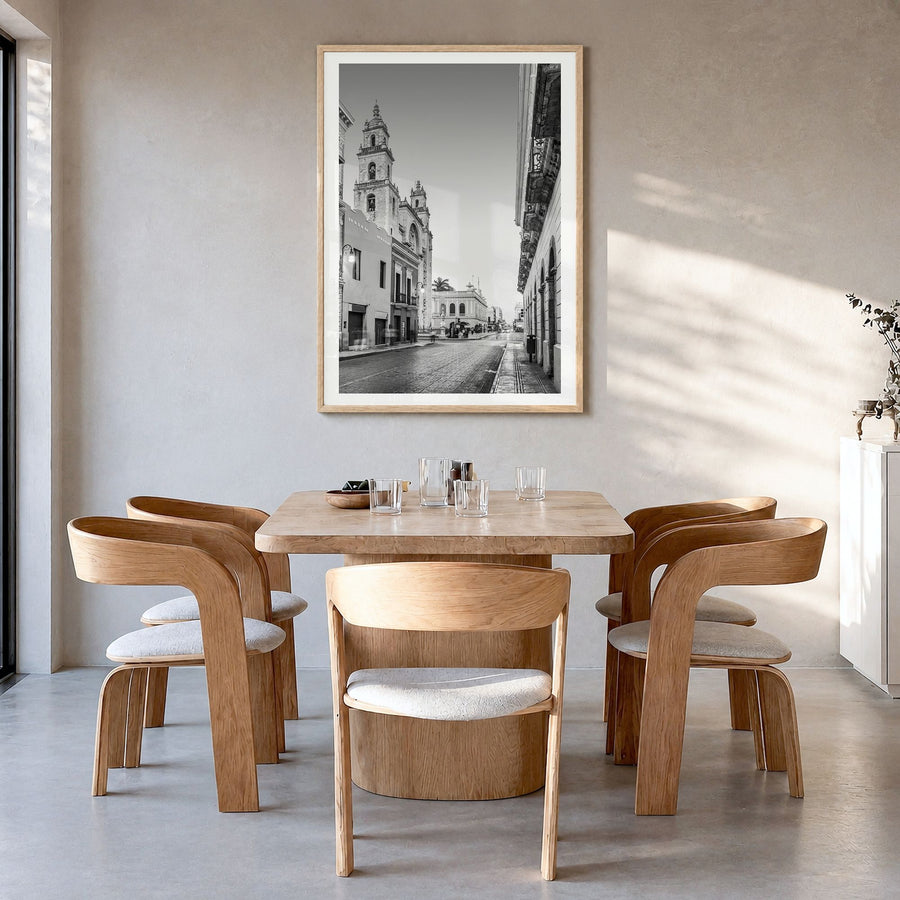 Mérida Photo Poster in a natural wood frame, hanging in a dining room, white border