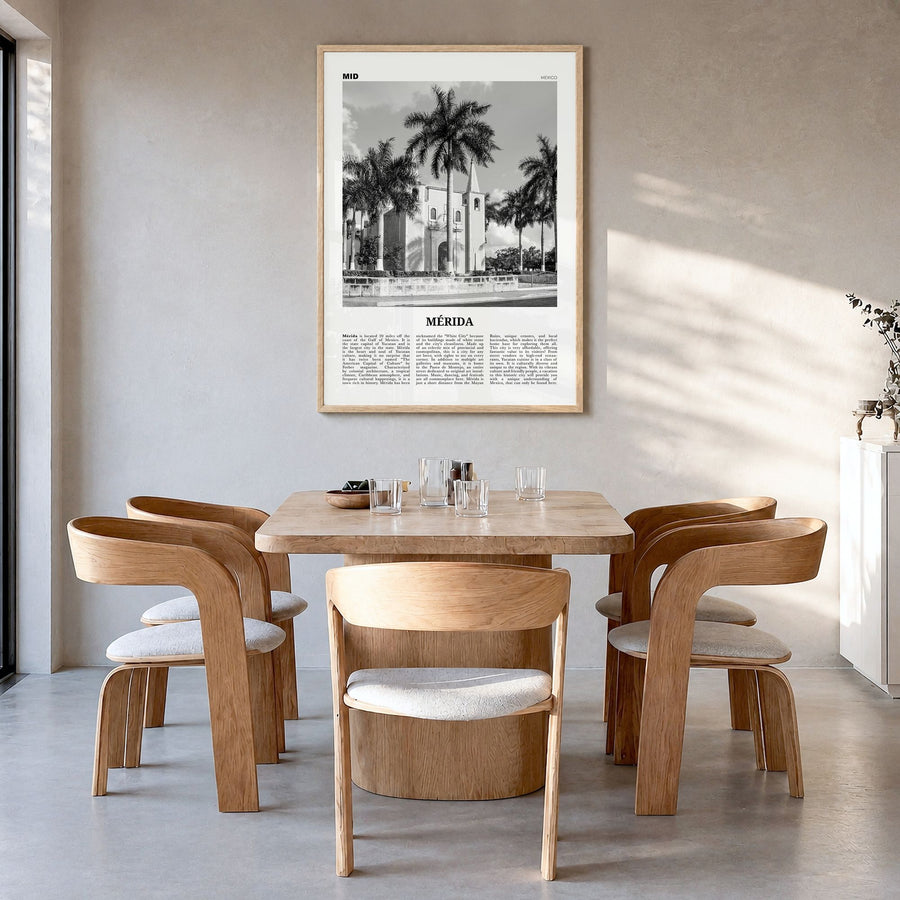 Mérida Newspaper Poster in a natural wood frame, hanging in a dining room