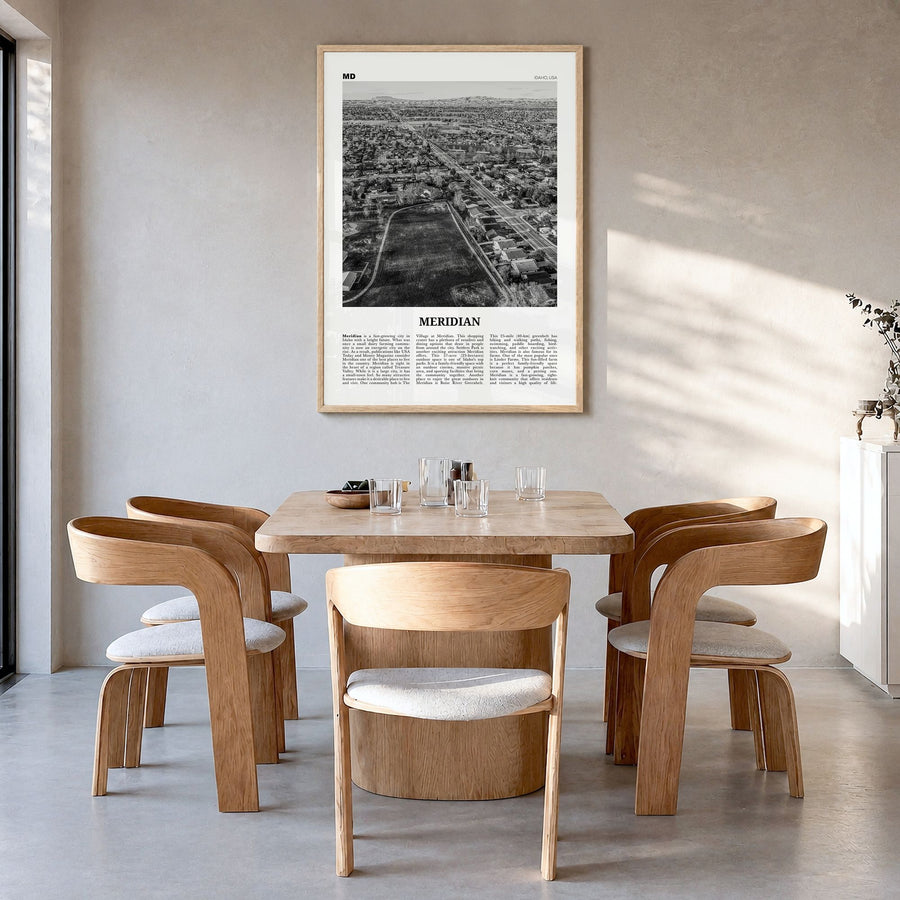 Meridian Newspaper Poster in a natural wood frame, hanging in a dining room
