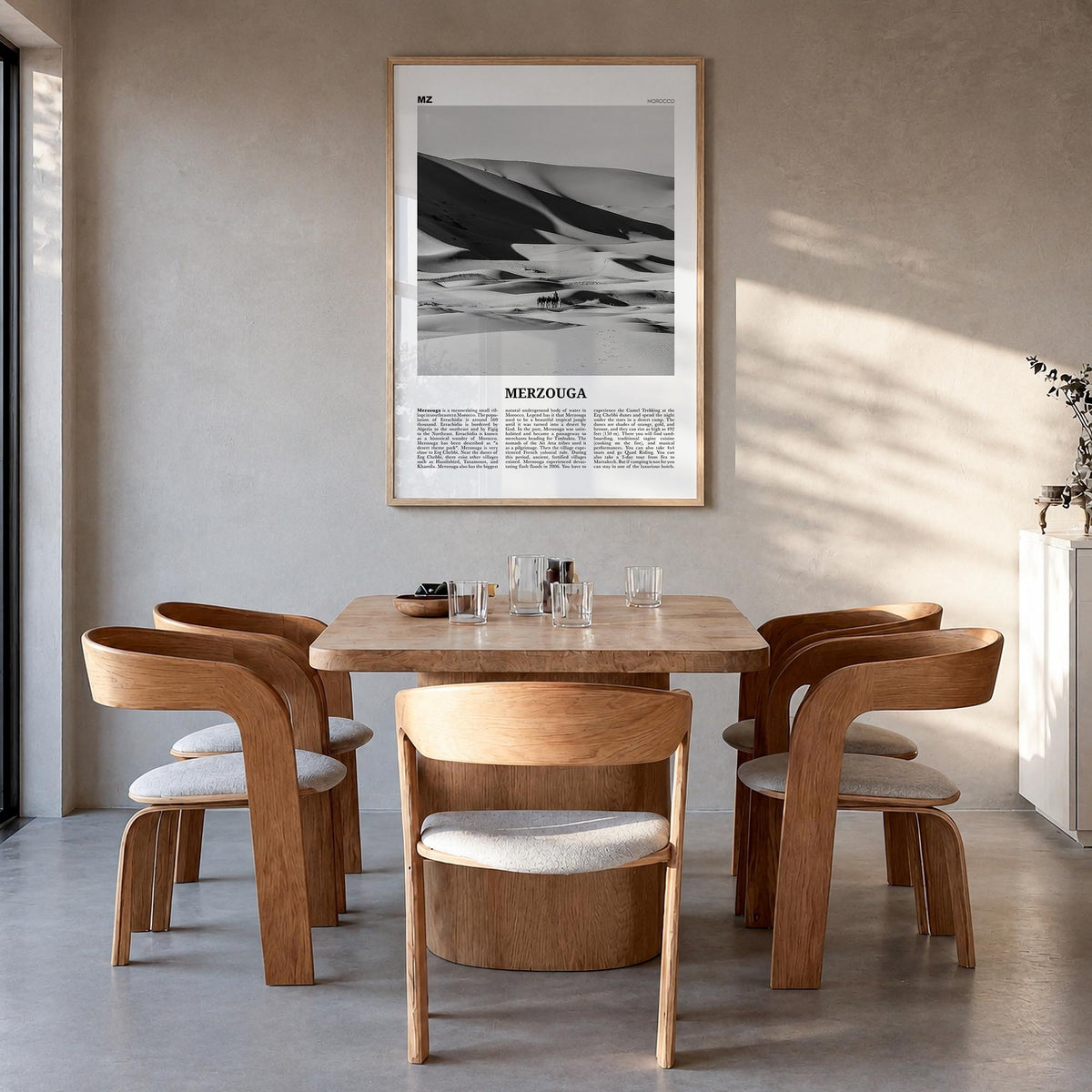 Merzouga black & white newspaper poster of Morocco – vertical wall art in natural wood frame, hanging on wall