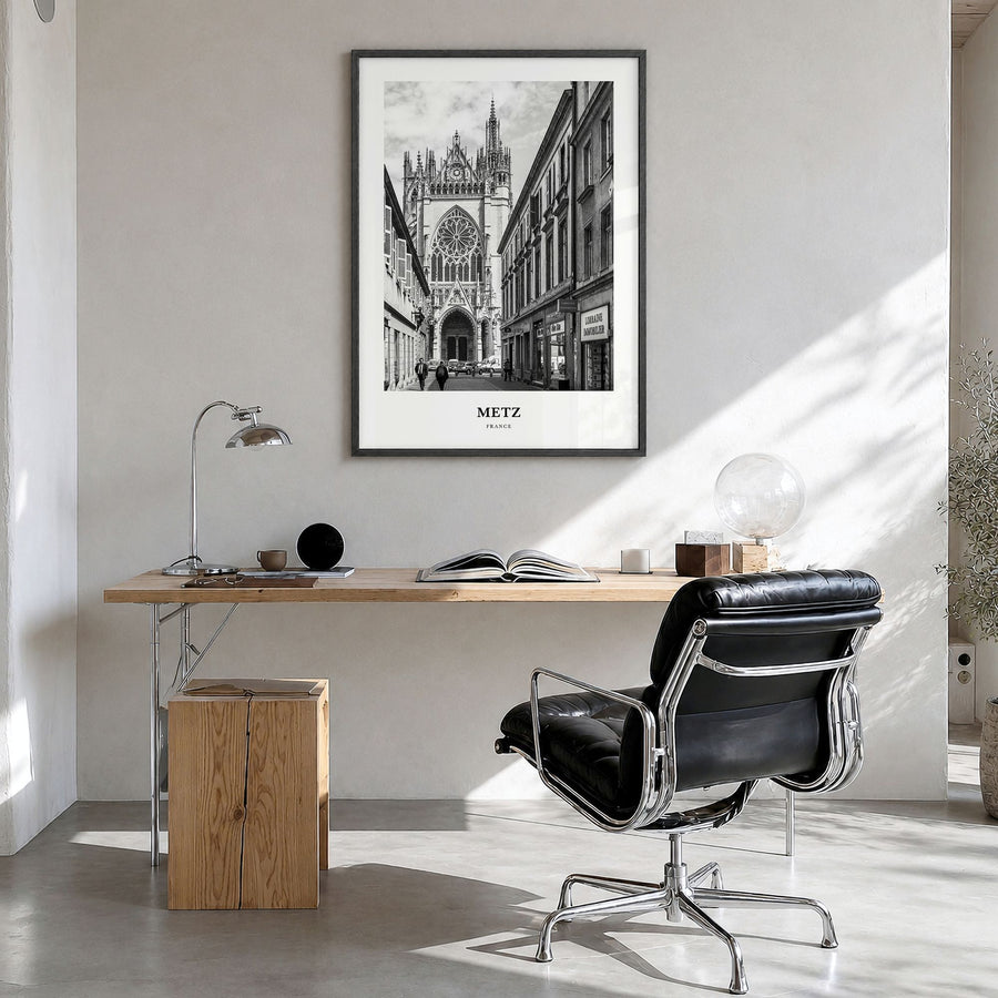 Metz Classic Poster in a black wood frame, hanging in a bright home office