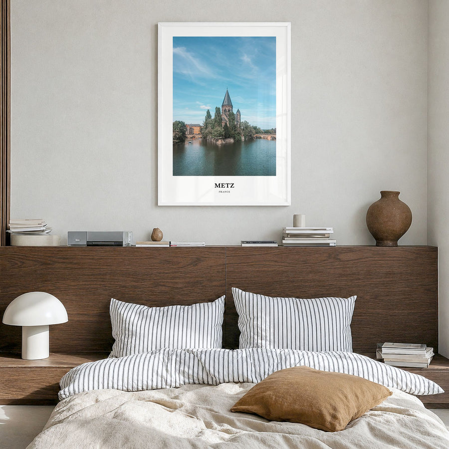 Metz Classic Poster in a white wood frame, hanging in a bedroom
