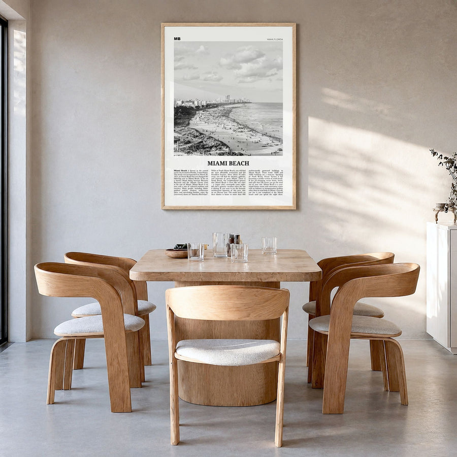 Miami Beach Newspaper Poster in a natural wood frame, hanging in a dining room