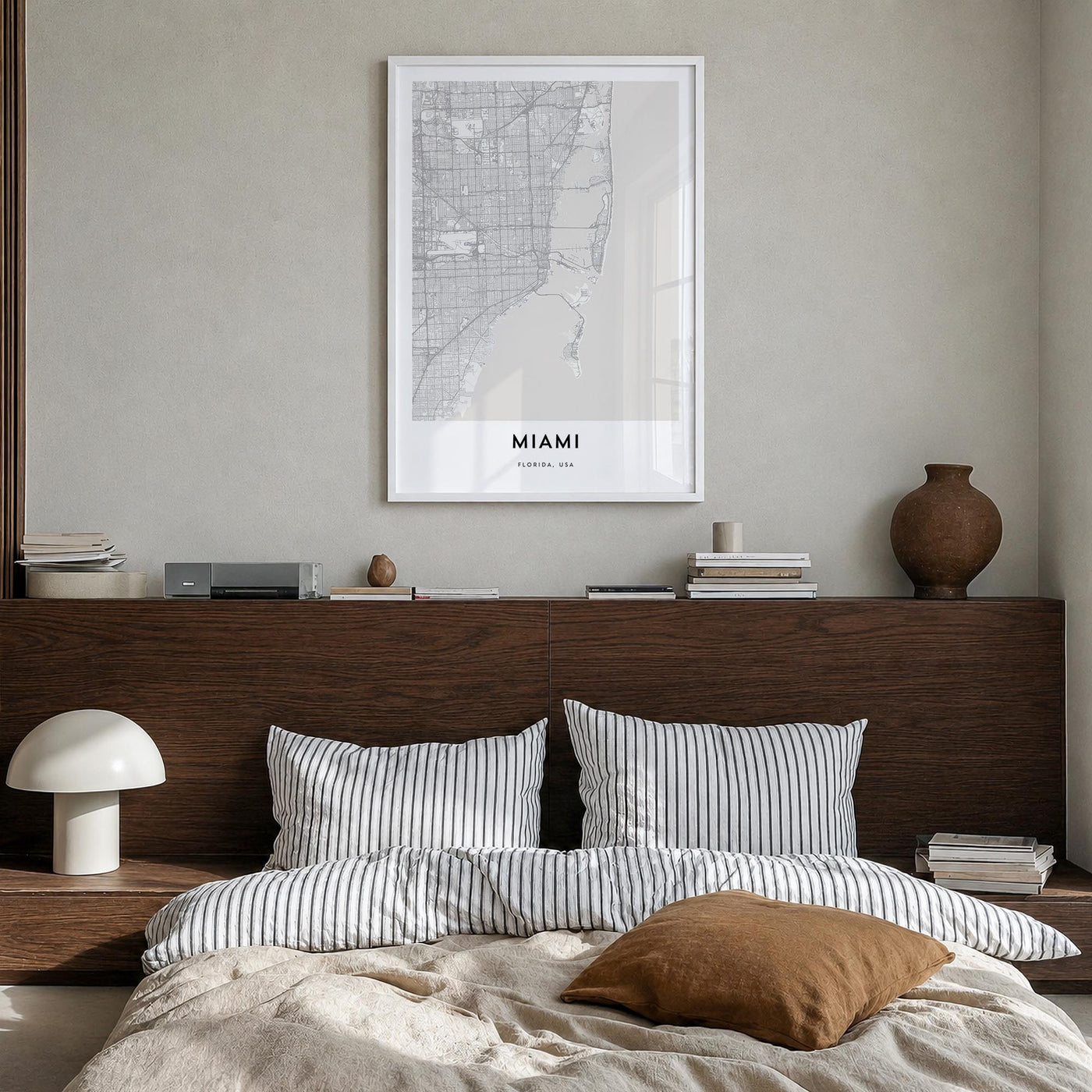 Miami black & white map poster of Florida, USA – vertical wall art in white wood frame, hanging on wall
