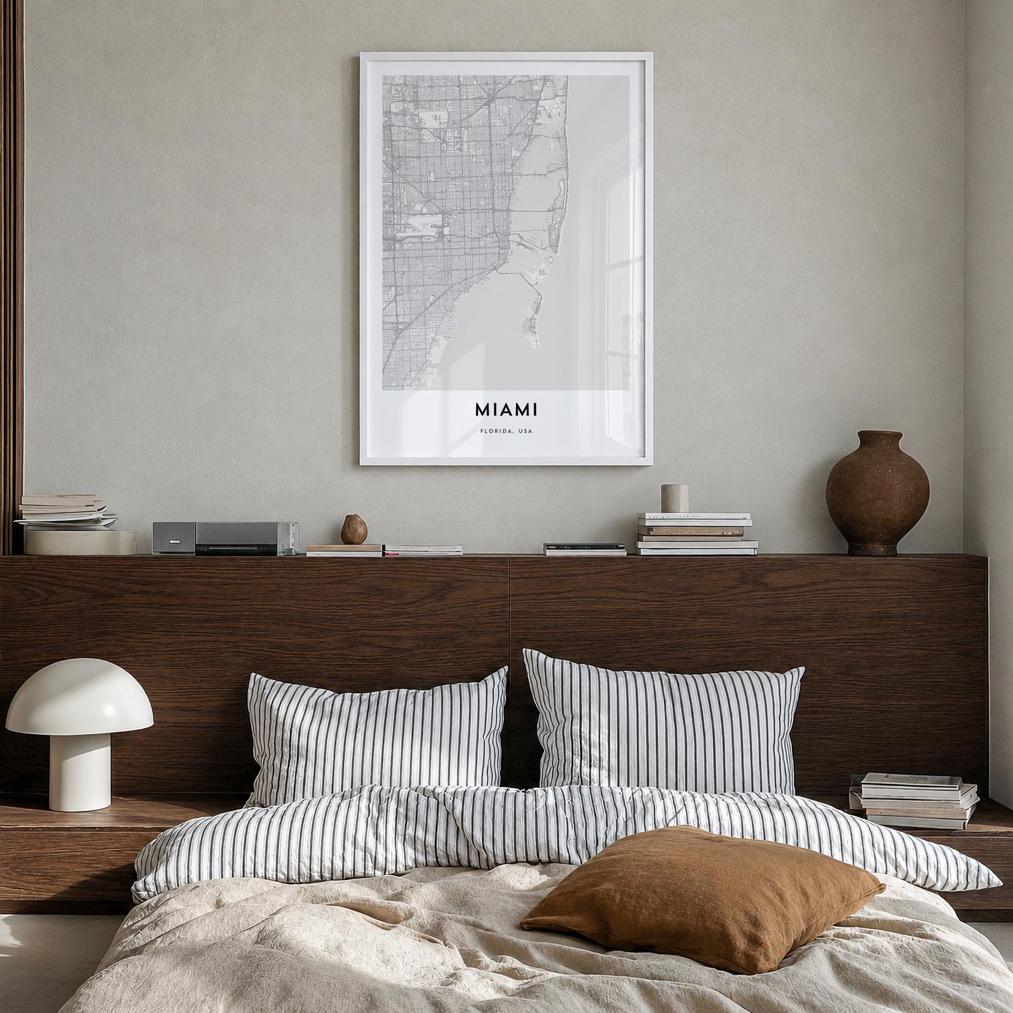 Miami black & white map poster of Florida, USA – vertical wall art in white wood frame, hanging on wall