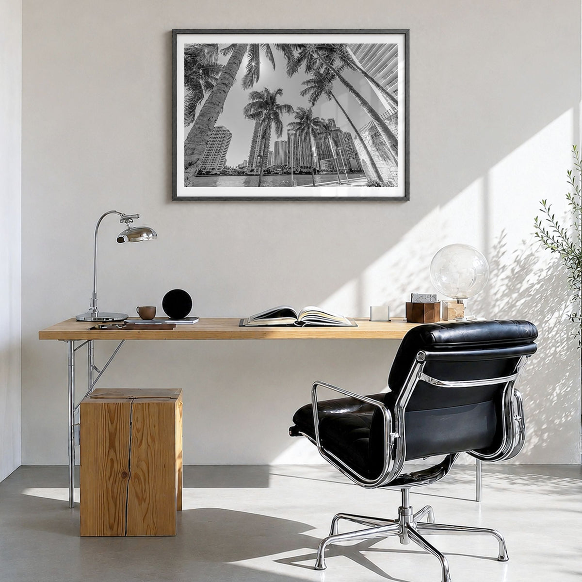 Miami Photo Poster in a black wood frame, hanging in a bright home office, white border