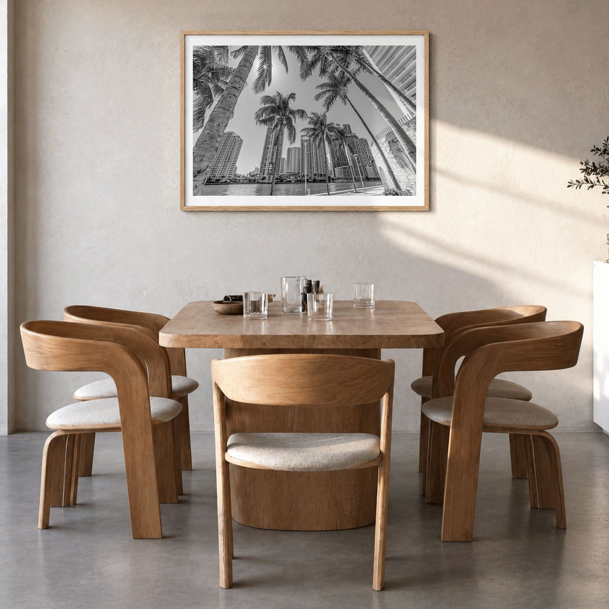 Miami Photo Poster in a natural wood frame, hanging in a dining room, white border