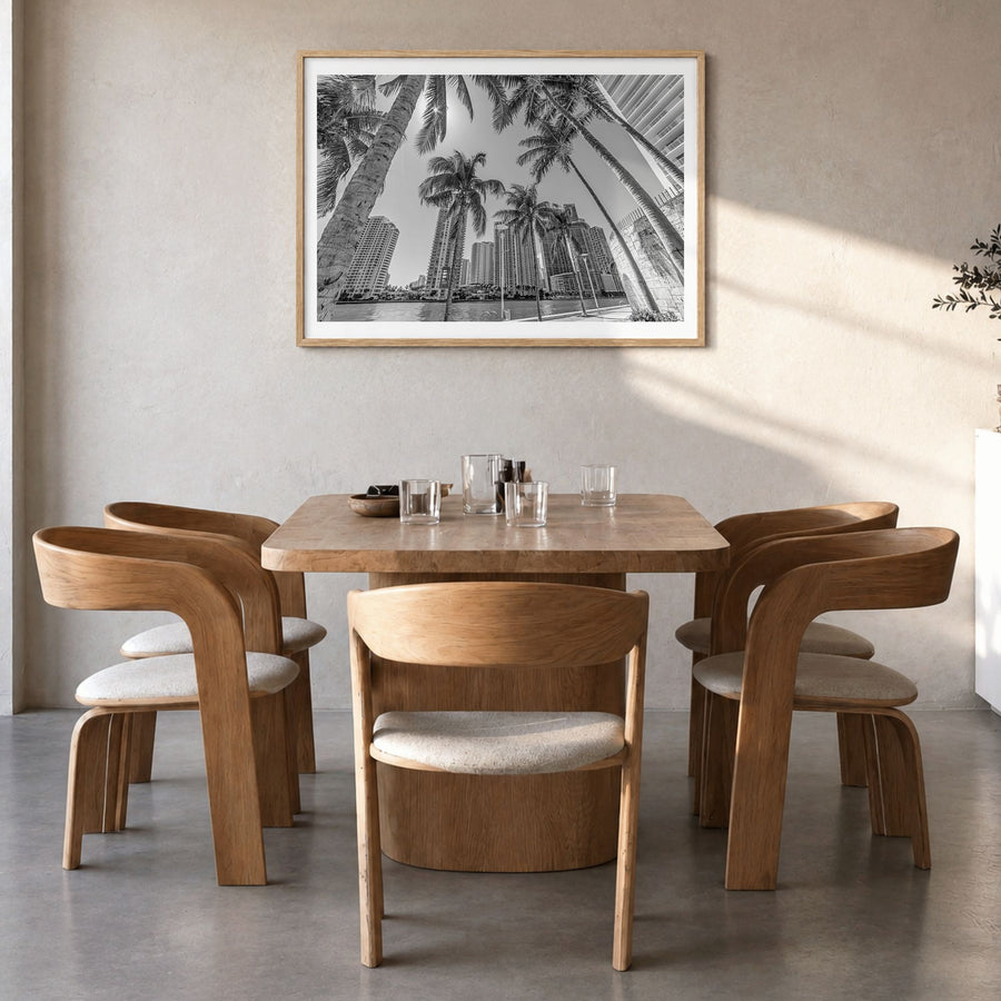 Miami Photo Poster in a natural wood frame, hanging in a dining room, white border