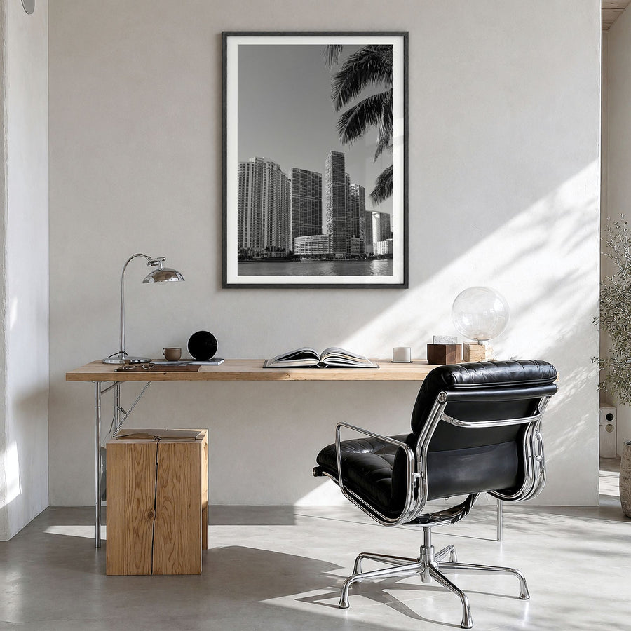 Miami Photo No 1 Poster in a black wood frame, hanging in a bright home office, white border