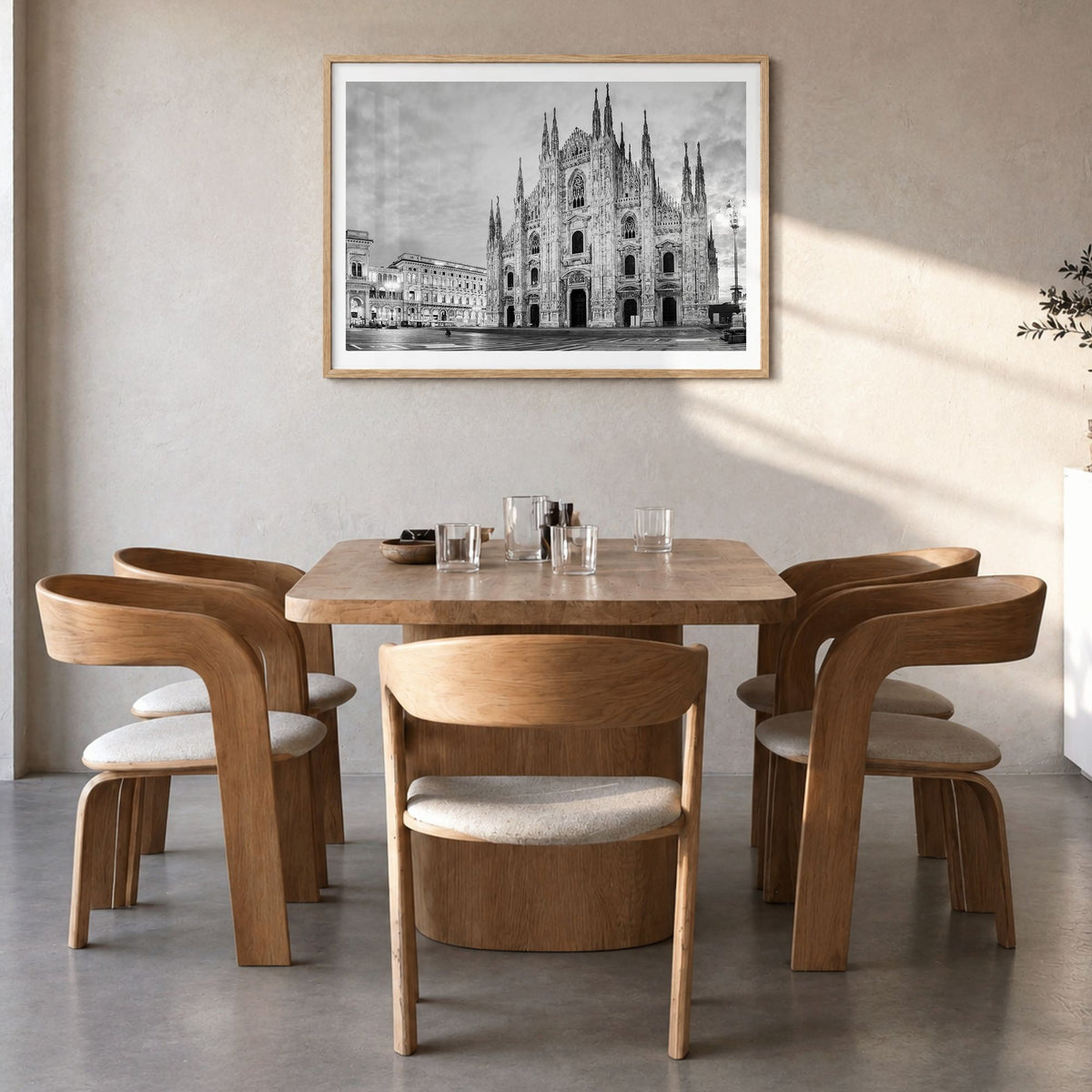 Milan Photo Poster in a natural wood frame, hanging in a dining room, white border