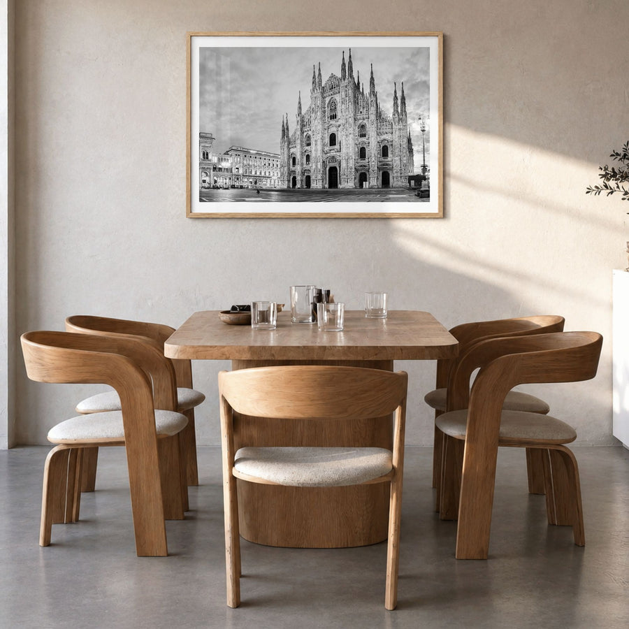 Milan Photo Poster in a natural wood frame, hanging in a dining room, white border