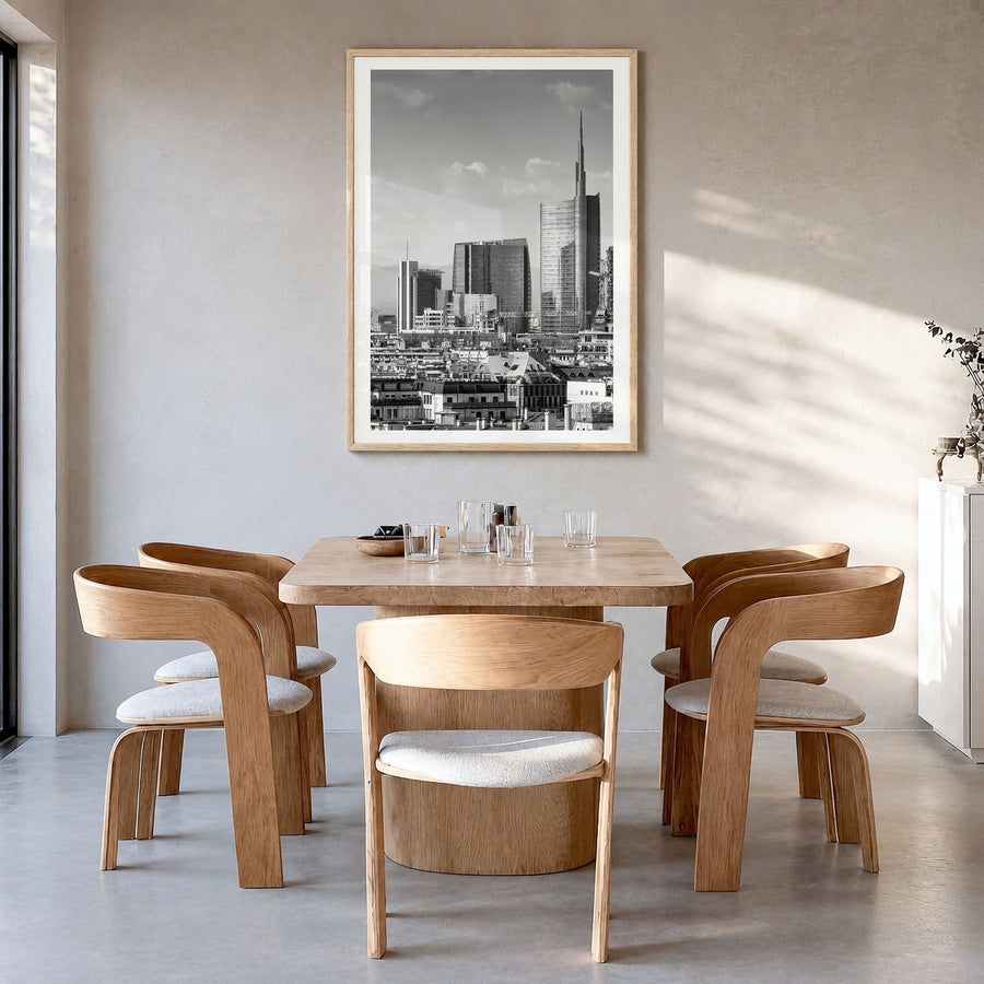 Milan Photo Poster in a natural wood frame, hanging in a dining room, white border
