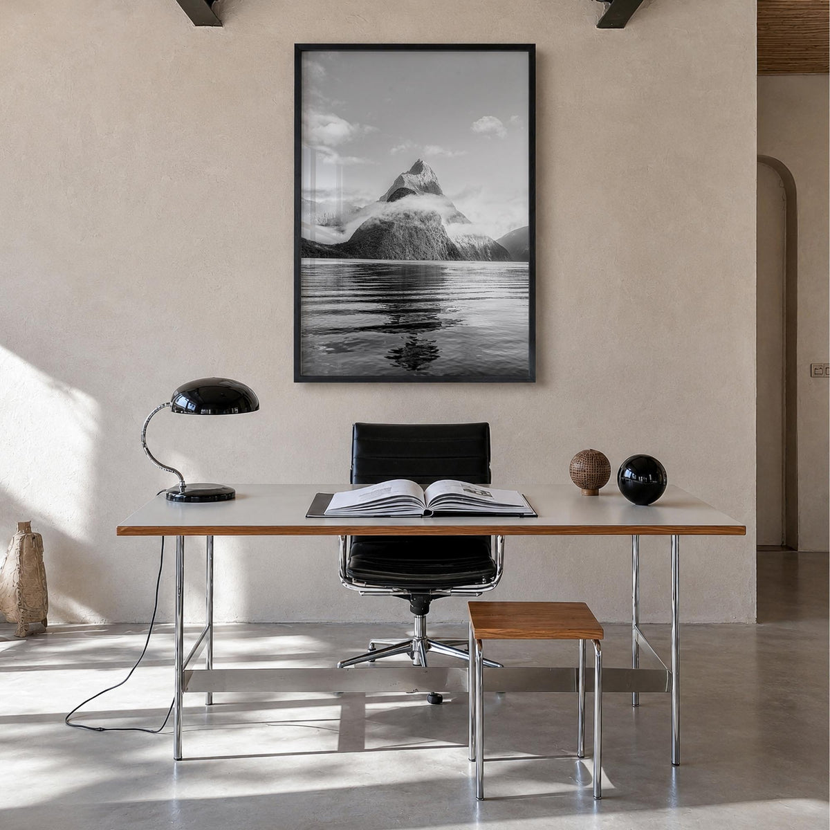 Milford Sound black & white photo poster of New Zealand – vertical wall art in black wood frame, hanging on wall