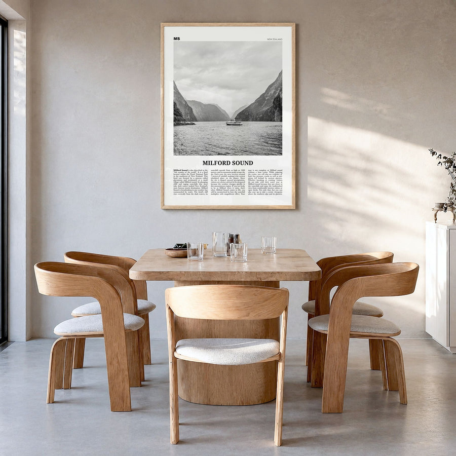 Milford Sound Newspaper Poster in a natural wood frame, hanging in a dining room