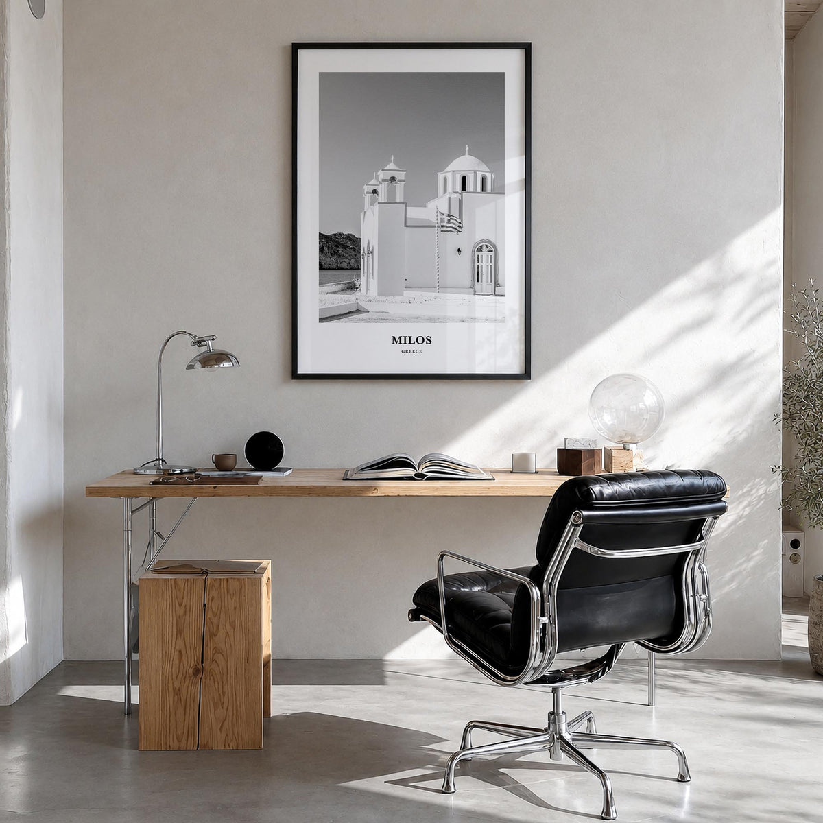 Milos black & white classic poster of Greece – vertical wall art in black wood frame, hanging on wall