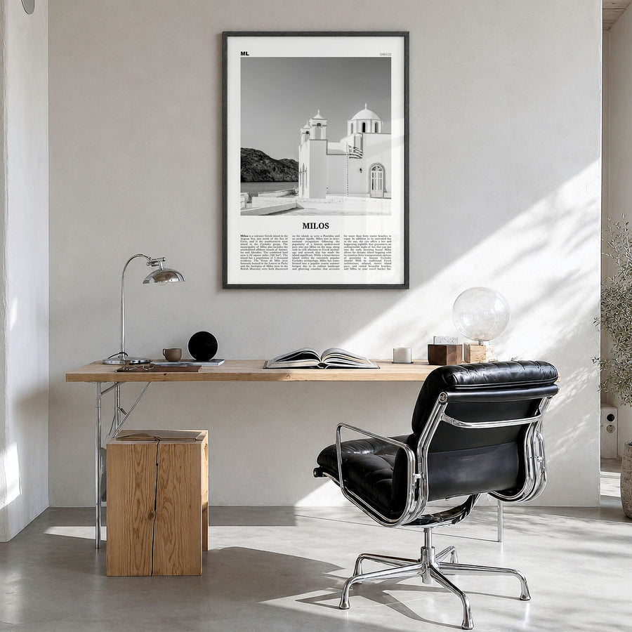 Milos Newspaper Poster in a black wood frame, hanging in a bright home office