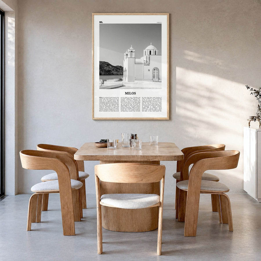 Milos Newspaper Poster in a natural wood frame, hanging in a dining room