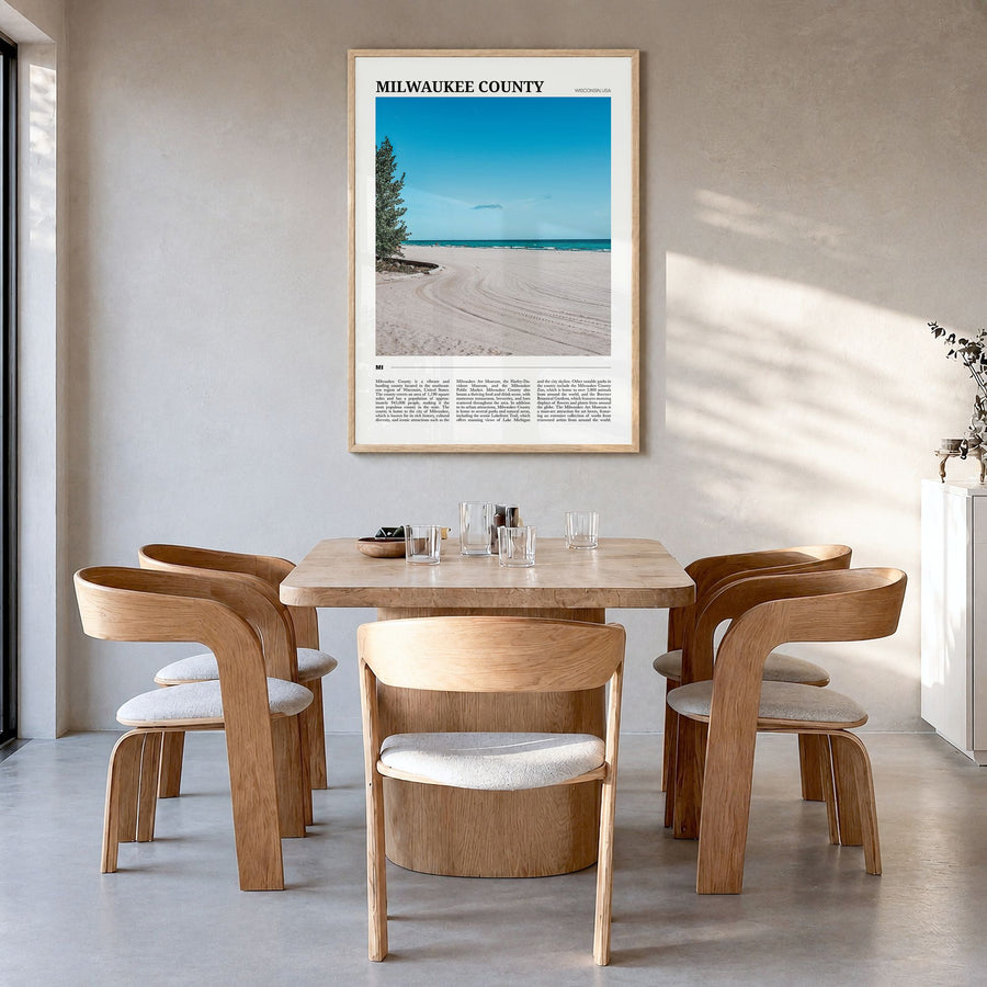 Milwaukee County Travel Poster in a natural wood frame, hanging in a dining room