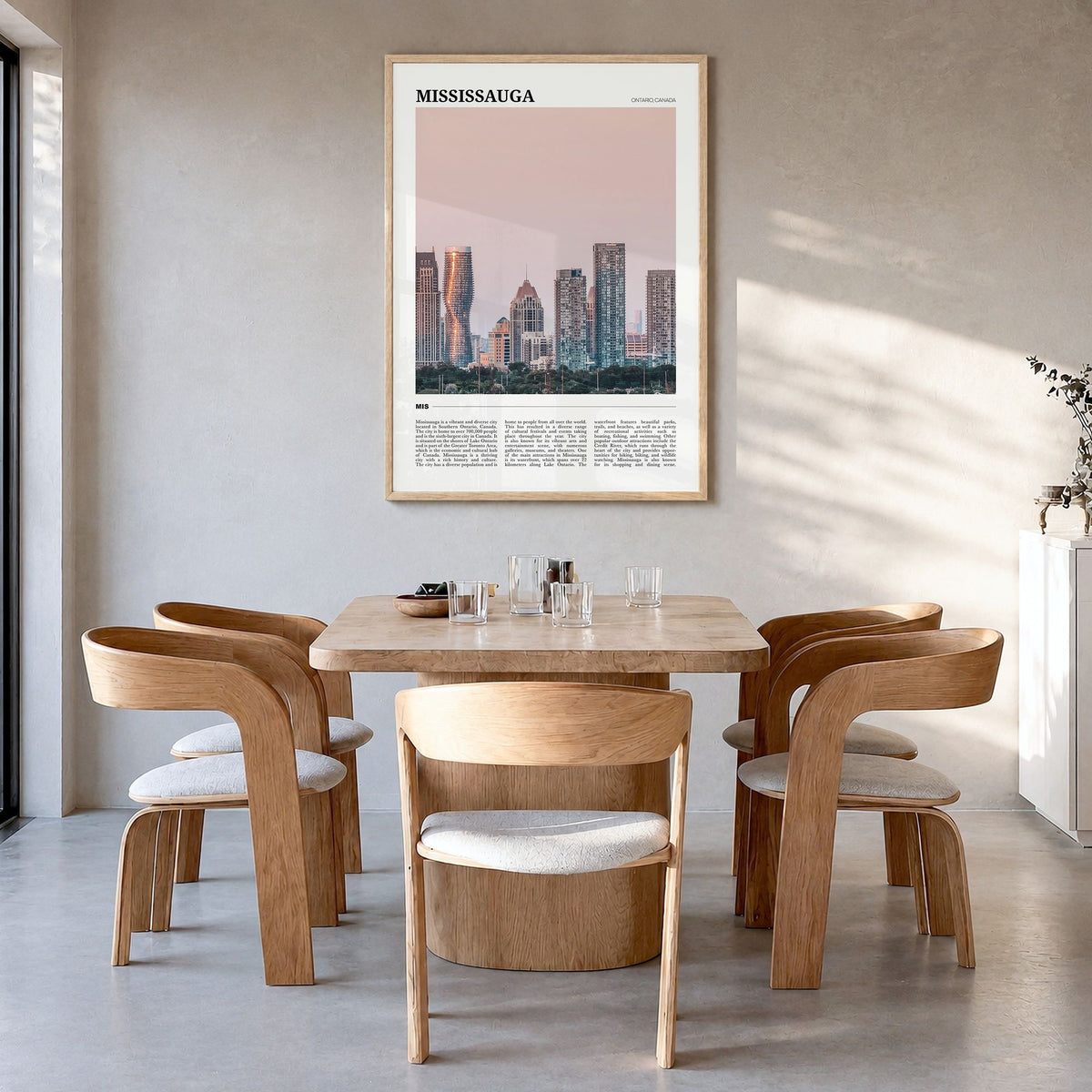 Mississauga Travel Poster in a natural wood frame, hanging in a dining room