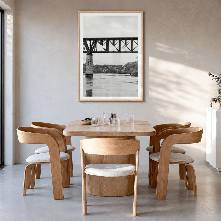 Mississippi River Photo Poster in a natural wood frame, hanging in a dining room, white border