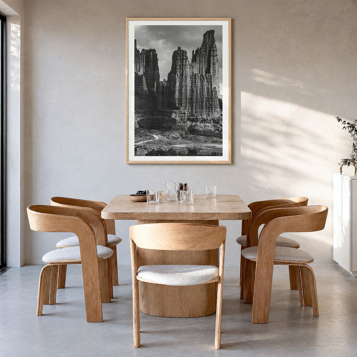 Moab Photo Poster in a natural wood frame, hanging in a dining room, white border
