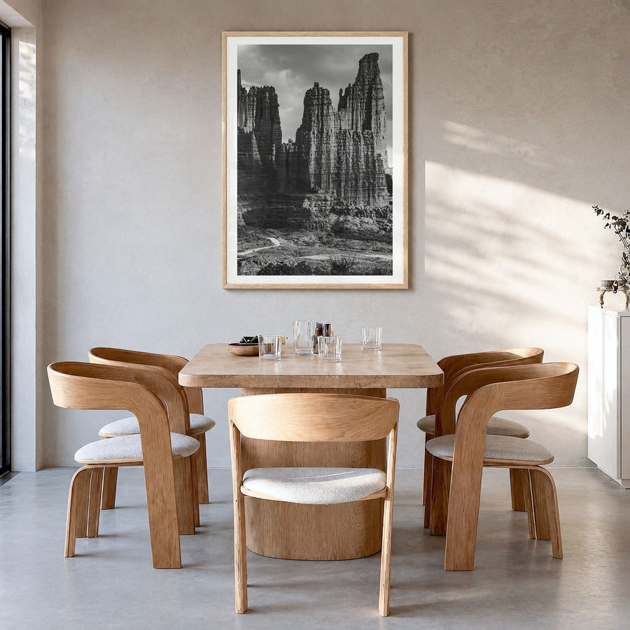 Moab Photo Poster in a natural wood frame, hanging in a dining room, white border