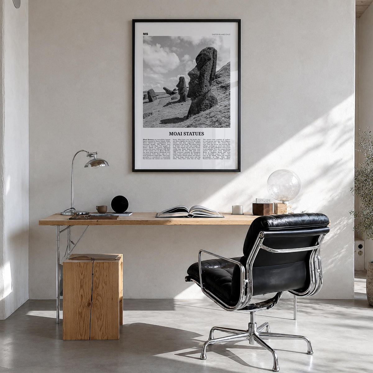 Moai Statues black & white newspaper poster of Chile – vertical wall art in black wood frame, hanging on wall