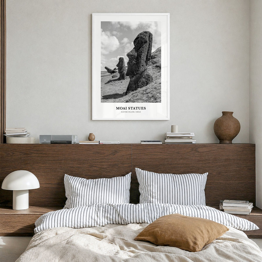 Moai Statues Classic Poster in a white wood frame, hanging in a bedroom