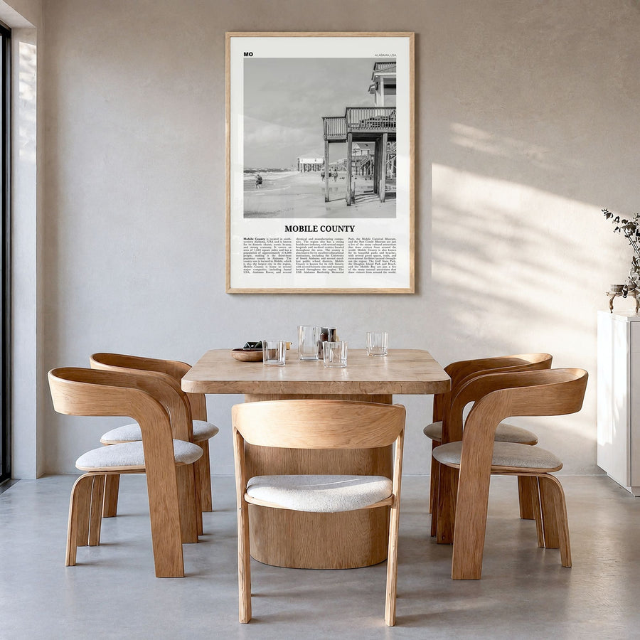 Mobile County Newspaper Poster in a natural wood frame, hanging in a dining room