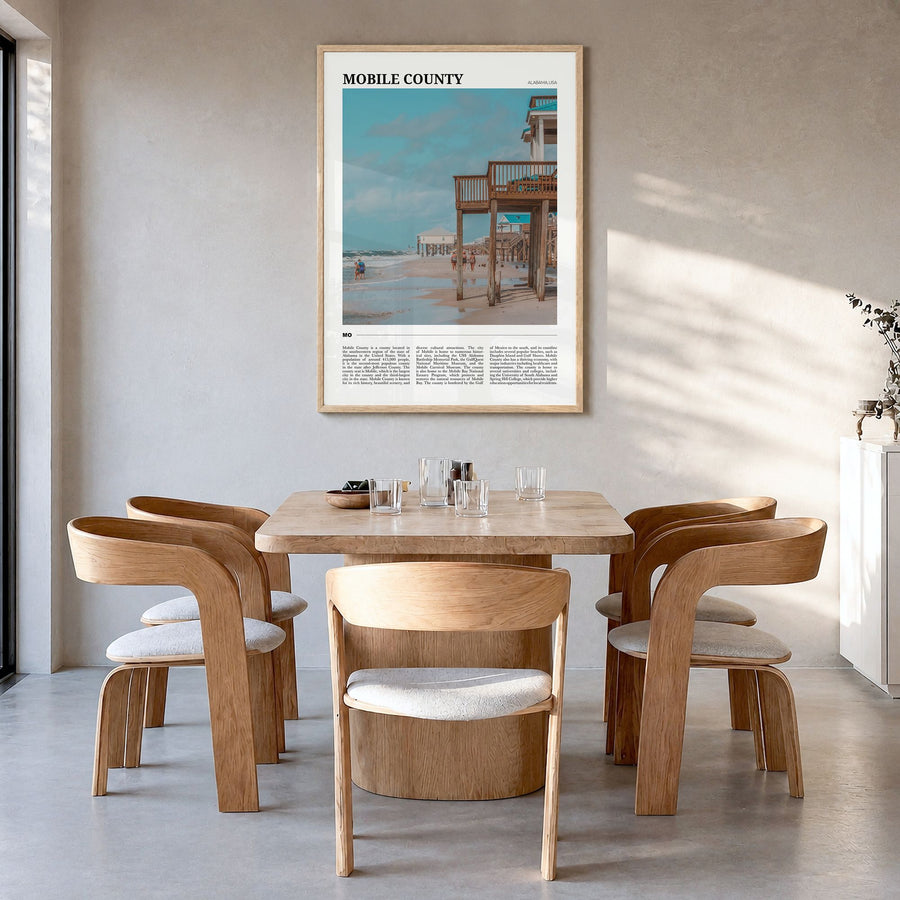 Mobile County Travel Poster in a natural wood frame, hanging in a dining room