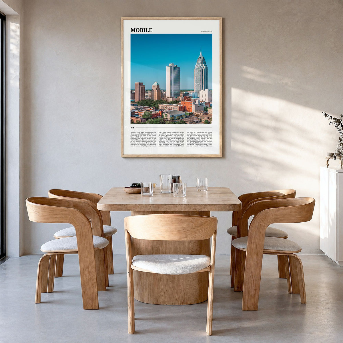 Mobile Travel Poster in a natural wood frame, hanging in a dining room