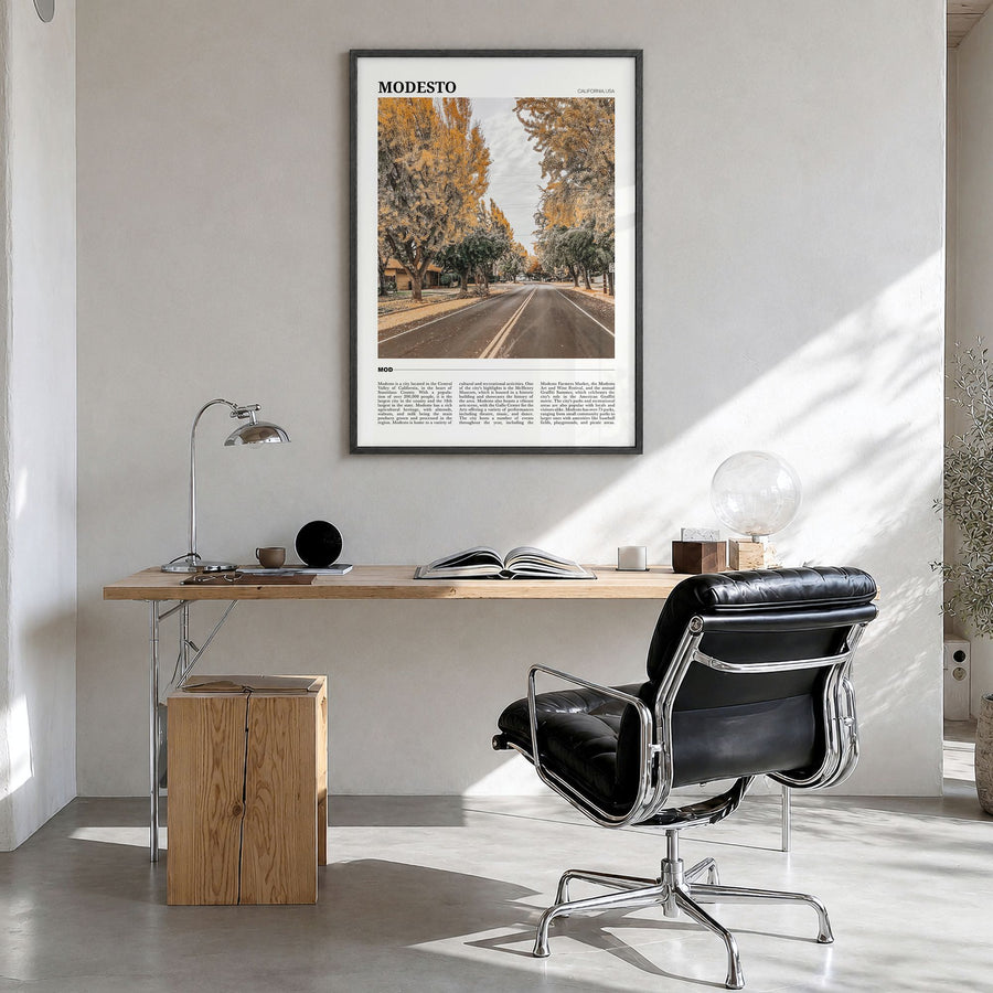 Modesto Travel Poster in a black wood frame, hanging in a bright home office