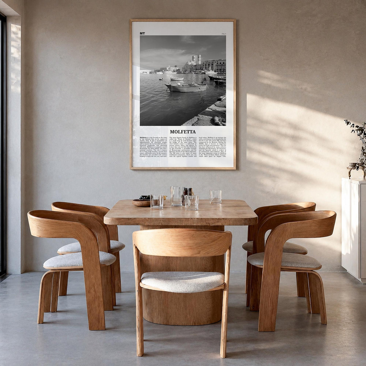 Molfetta black & white newspaper poster of Italy – vertical wall art in natural wood frame, hanging on wall
