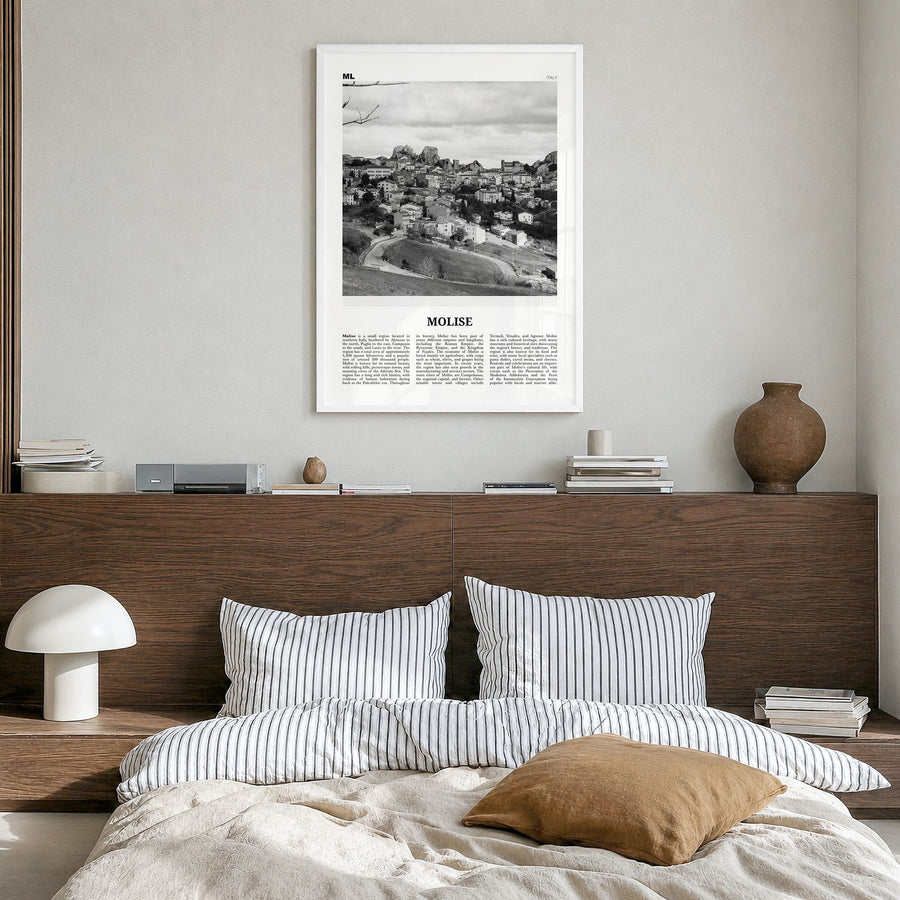 Molise Newspaper Poster in a white wood frame, hanging in a bedroom